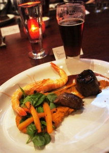 Mixed Grill with Wild Boar Sausage, Buffalo Filet, and Hawaiian Blue Prawn served with Pumpkin Puree and a Rich Stout Reduction